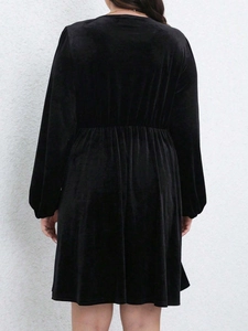 Elegant black velvet maxi dress featuring long lantern sleeves and a ruched waist design