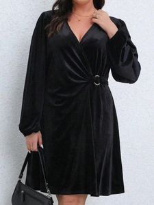 Elegant black velvet V-neck wrap dress with lantern sleeves and metal waist buckle