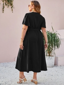 Elegant black midi dress featuring ruffle sleeves and a waist tie shown from back view