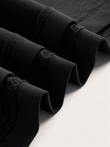 Women's black halter neck top featuring premium double-needle stitching on knit fabric