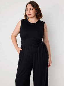 Women's plus size black sleeveless knit jumpsuit with cinched waist and wide leg cut