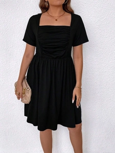 Elegant plus size black square neck dress with ruched bodice and A-line short sleeves