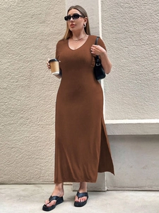 Detailed macro view of the ribbed knit fabric texture and high side slit on brown dress