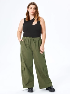 Plus size black ribbed sleeveless top with cutout and green cargo pants set
