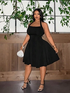Elegant black halter neck A-line mini dress with a square neckline and cinched waist