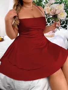 Elegant deep red satin slip dress with ruffled hem and flattering pleated waist