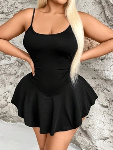 Slim fit black mini camisole dress with ruffled hemline for a minimalist elegant look