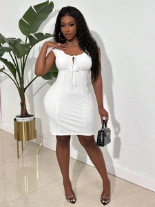 Close-up of the breathable white rib-knit fabric on a slim-fit short dress for women
