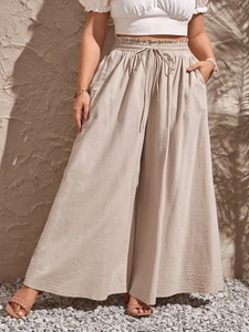 Women high waist beige wide leg trousers with drawstring and pockets for summer