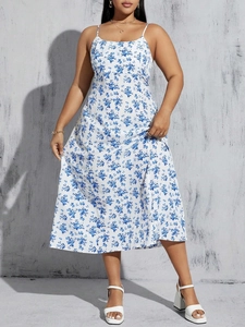 Detail of blue floral print sundress featuring thin straps and breathable woven fabric