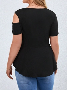 Detail view of black off-shoulder T-shirt with cut-out shoulder and peplum hem design