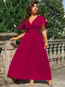 Detail of the elegant deep V-neckline and ruffled short sleeves on this plus size maxi dress