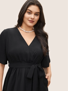 Elegant plus size black V-neck dress with long sleeves and a self-tie waist belt