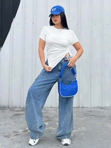 Detail of white short sleeve T-shirt featuring side drawstring ruched asymmetric hem