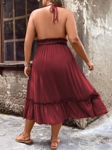 Women's backless halter midi dress in deep red with elastic waist and ruffled hem