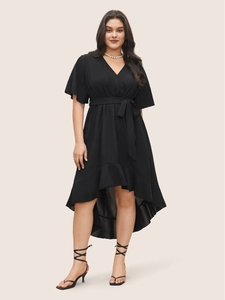Elegant black plus size V-neck dress with irregular high-low hem and waist tie