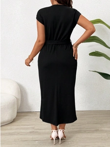 Elegant plus size black short sleeve midi dress with slim waist belt seen from back