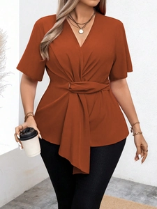 Elegant burnt orange V-neck short sleeve top with waist tie detail for stylish women