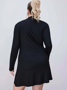 Back view of black long sleeve ribbed dress with slim fit and turtleneck design