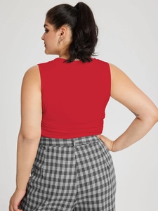 Slim fit red sleeveless tank top for women paired with stylish checkered trousers