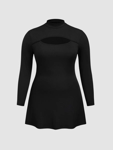Detail of black long sleeve mini dress featuring chest cut-out and ribbed texture