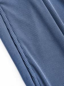 Blue ribbed sleeveless summer romper with side pocket detail and vertical textured fabric