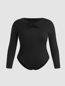 Slim fit black ribbed bodysuit with long sleeves, twist front and cutout detail