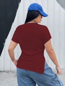 Close-up of wine red slim-fit t-shirt with ribbed cotton texture and asymmetric side slit