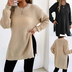 Close-up detail of side split hem on a knit long-sleeve crewneck sweater for women