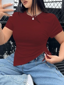 Detail of burgundy ribbed T-shirt showing adjustable side drawstring and ruched hemline