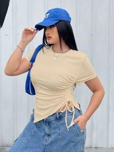 Detail view of beige ribbed knit T-shirt with side drawstring and adjustable ruched hem