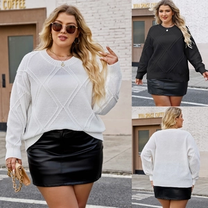 Close-up of diamond knit texture and loose-fit design on this women's oversized sweater