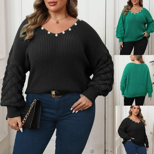 Detail of V-neckline with white pearl beads and textured balloon sleeves on a plus-size sweater