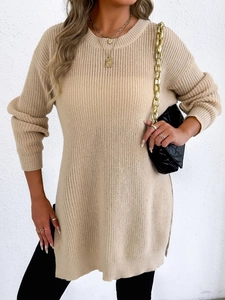 Detail of beige crew neck knit sweater featuring vertical ribbed texture and side slit