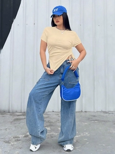 Detail of slim fit crew neck T-shirt featuring side drawstring ruching and irregular hem