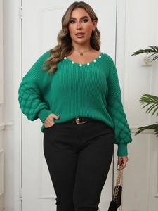 Detail of green plus size V-neck sweater with pearl embellishments and bubble knit sleeves