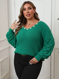 Emerald green V-neck knit sweater with pearl beads and textured pineapple sleeves