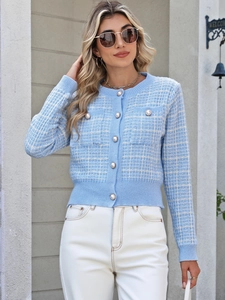 Detailed view of the light blue plaid cardigan featuring elegant pearl buttons and texture