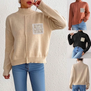 Detail of mock neck sweater featuring sequin crochet floral pocket and knit texture