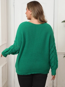 Women's green V-neck sweater featuring unique 3D knit lace sleeves and loose silhouette