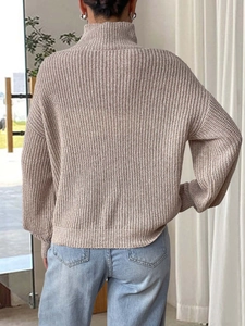 Beige ribbed knit turtleneck sweater with 3D floral details and a relaxed fit design