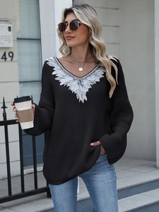 Women's V-neck knit sweater with white lace embroidery and silver sequins in a loose fit