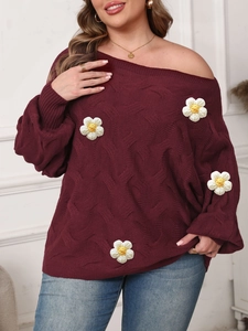 Close-up of wine red cable knit off-shoulder sweater with 3D floral crochet appliques