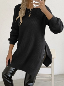 Women's black crewneck knit sweater with side slits and long sleeves in loose fit style