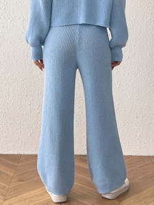 Women's light blue knit lounge set with round neck sweater and wide leg pants back view