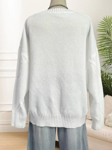Women's white chunky knit sweater with textured honeycomb pattern and loose fit
