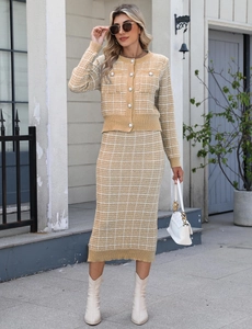 Close-up of elegant pearl button details on plaid knit cardigan and pencil skirt set