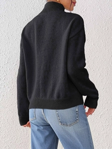 Women's black high neck knit sweater with long sleeves and detailed knit texture back view