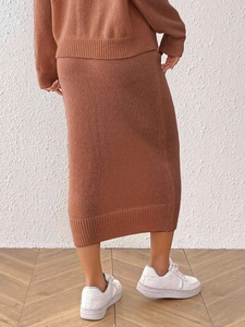 Caramel brown knit two-piece set featuring a long sleeve top and a midi pencil skirt