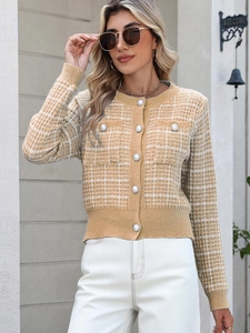 Close-up of yellow plaid knit cardigan featuring decorative pearl buttons and round neck